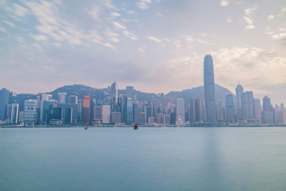 The Hong Kong skyline viewed from Victoria Harbour during daylight.
