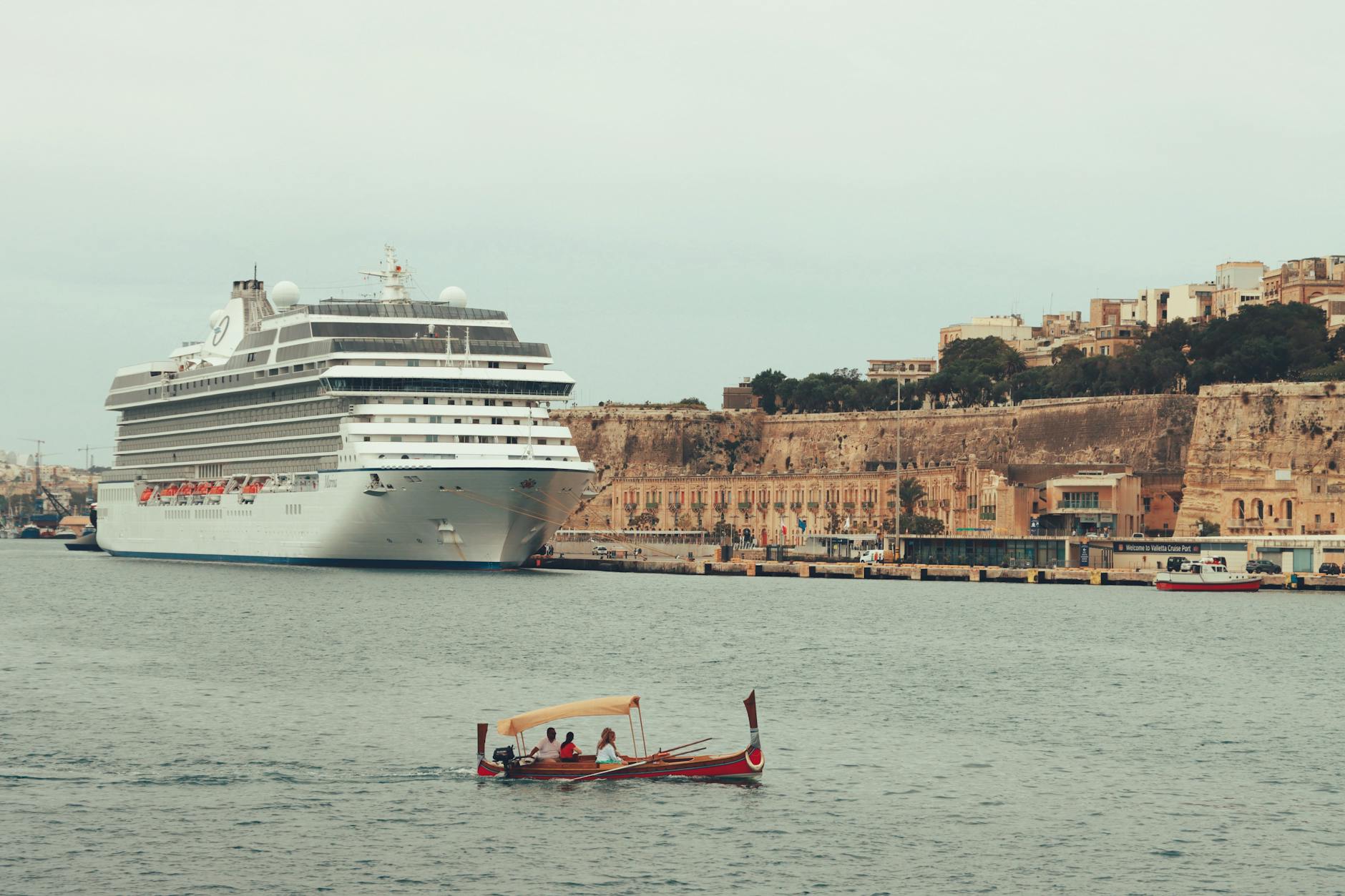 Mediterranean coastline at warm dawn light, representing the ITC Malta 2026 conference setting.